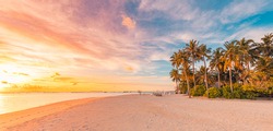 Island palm tree sea sand beach. Panoramic beach landscape. Inspire tropical beach seascape horizon. Orange and golden sunset sky calmness tranquil relaxing summer mood. Vacation travel holiday banner