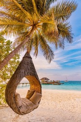 Tropical beach sunset as summer landscape with luxury resort beach palm swing hammock, sand seaside shore for sunset beach landscape. Tranquil beach horizon scenery vacation and summer holiday concept