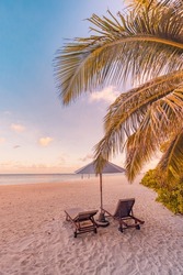Amazing beach. Chairs on the sandy beach sea. Luxury summer holiday and vacation resort hotel for tourism. Inspirational tropical landscape. Tranquil scenery, relax beach, beautiful landscape design