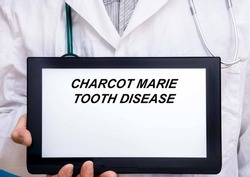 Charcot Marie Tooth Disease.  Doctor with rare or orphan disease text on tablet screen Charcot Marie Tooth Disease
