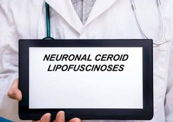 Neuronal Ceroid Lipofuscinoses.  Doctor with rare or orphan disease text on tablet screen Neuronal Ceroid Lipofuscinoses