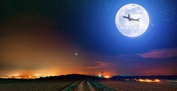 full moon with a flying plane against the background of the night starry sky