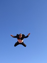 flying businessman without parachute