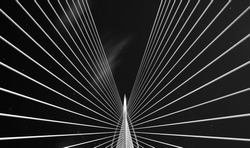 Abstract black and white bridge and sky .