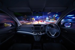 Modern black car dashboard interior with moving motion blur street background, luxury car interior concept .