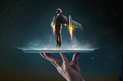 Waiter hand holding an empty digital tablet with Businessman wear a rocket suit to lift , Business success concept .