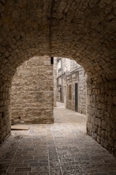 Ancient arched passageway in the old town of Budva, Montenegro