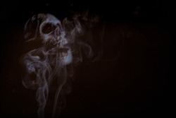 Ghost skulls horror background with a mist