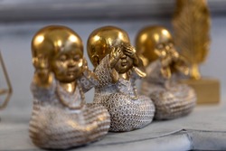 Three Wise little Buddha figurine in a row, Hear no evil, See no evil, Speak no evil, Bronze little statue home decoration concept