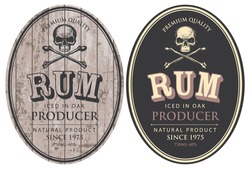 Set of two vector labels for Rum in oval frames with human skulls and crossbones on a wooden and black background in retro style.