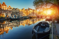 Amsterdam canal at sunset. Amsterdam is the capital and most populous city in Netherlands. 