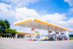  Blurred and soft of gas station with blue sky.