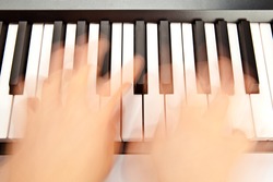 Someone playing piano in motion