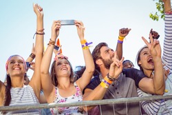 Excited music fans up the front at a music festival