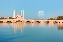 The Stone Bridge and Sabanci Mosque with full moon - Adana, Turkey               
