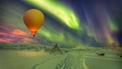 Hot air balloon flying with spectacular Northern lights - Northern lights (Aurora borealis) in the sky over Tromso, Norway