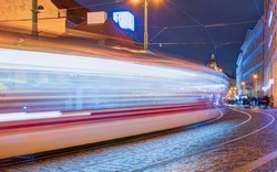 Long exposure concept - Tram moving on a street at dusk - Vienna, Austria