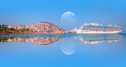 The cruise ship is located on Kusadasi Island in the port of Kusadasi, Turkey