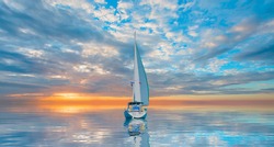 Lonely yacht sailing in the Mediterranean sea at amazing sunset - Sailing luxury yacht with white sails in the Sea.