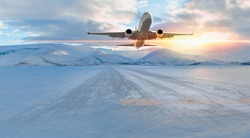 Commercical white airplane fly up over take-off runway the (ice) snow-covered airport- Norway