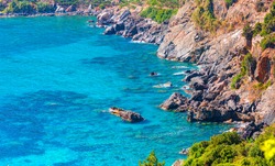 Turquoise sea waters in rocks near Antiocheia Ad Cragum ancient town - Alanya, Turkey 