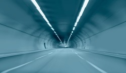 Abstract speed motion in blue highway road tunnel