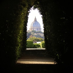 An amazing view of St. Peter's Dome through the Knights of Malta keyhole on the Aventine Hill in Rome.