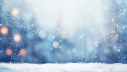 snowy Christmas  background with blur effect, falling snow flakes and sun rays