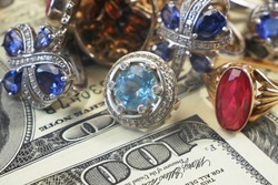 money and jewelry, pawn shop and buy and sell concept, golden rings, necklace bracelet, closeup