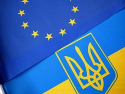 National flags Ukraine and flag of European Union background, European solidarity and friendship closeup, concept