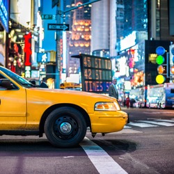 Yellow cabs in Manhattan, NYC. The taxicabs of New York City at night Time Square.