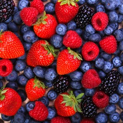 Berries Background. Strawberries, Blueberry, Raspberries, and Blackberry. 