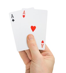 Hand with poker cards isolated on white background