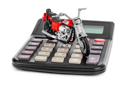 Calculator and toy motorbike isolated on white background