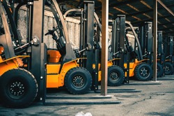 Background of a lot of forklifts, reliable heavy loader, truck. Heavy duty equipment, forklift
