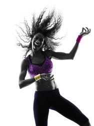 one african woman woman zumba dancer dancing exercises in studio silhouette isolated on white background