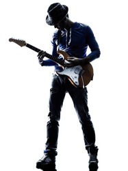 one caucasian man electric guitarist player playing in studio silhouette isolated on white background