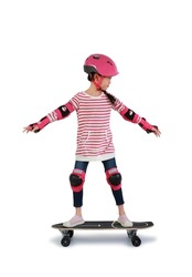 Asian little girl child skating on skateboard isolated over white background. Kid riding on skateboard. Image with Clipping path