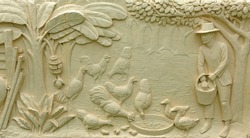 Native Thai culture stone carving on temple wall