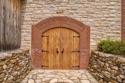 Front door of a rustic wine cellar.