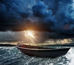 Wooden boat in a stormy sea 
