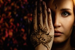 Woman with traditional mehndi henna ornament 