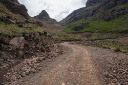 Rugged dirt road over mountain; Sani Pass on South Africa - Lesotho border.