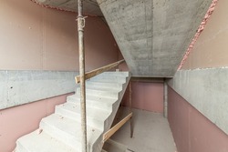 Unfinished concrete staircases on a buiiliding site. Construction. Unfinished building. Stair hall