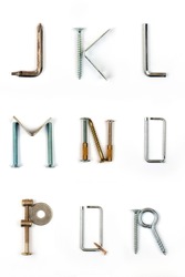 Industrial alphabet. Letters J, K, L, M, N, O, P, Q, R, made of nails and screw.