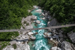Aerial drone view over bridge at Soca river in Slovenia, alpine scenery and landscape