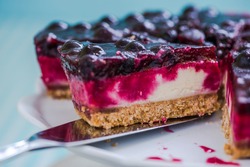 serving cheesecake with black forest fruits, taste of summer
