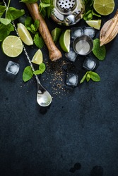 ingredients for cuban mojito cocktail on dark slate