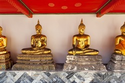 Gilt statues of the Buddha in a temple in Bangkok, Thailand