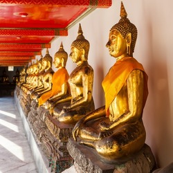 Gilded statues of the Buddha in a row, Bangkok, Thailand
